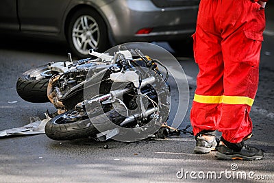 Crashed motorcycle after road accident with a car Editorial Stock Photo
