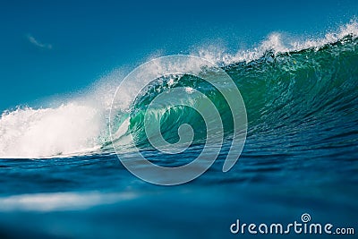 Crashing perfect blue wave. Breaking surfing wave, power of ocean Stock Photo