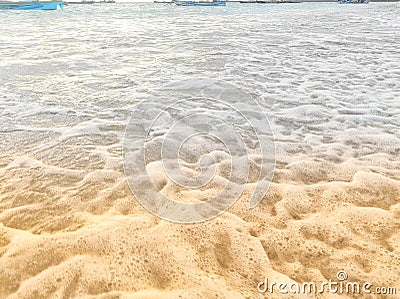 crashing waves, leaving behind a beautiful foamy wave Stock Photo