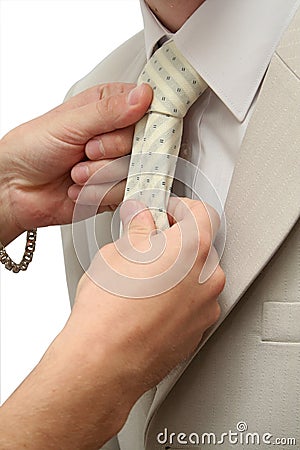 Cravat and woman's hands on isolated background Stock Photo