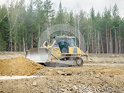 Crawler bulldozer on the construction of the highway Stock Photo