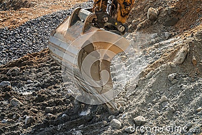 Crawler excavator digging on soil, excavating machine Stock Photo
