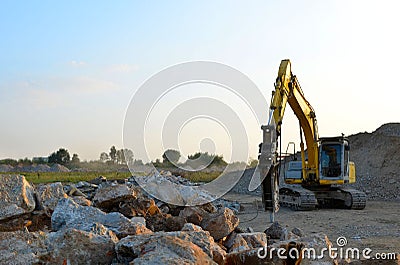 Crawler excavator with hydraulic breaker hammer for the destruction of concrete Stock Photo