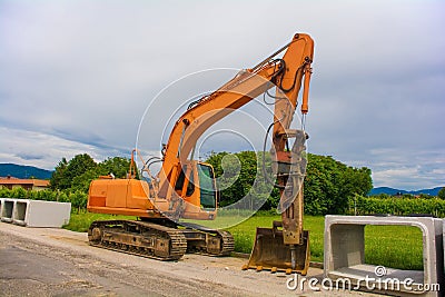 Crawler Excavator and Box Culverts Editorial Stock Photo