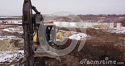 Crawler excavator working at the construction site. Construction machinery for excavating, loading, lifting and hauling Stock Photo