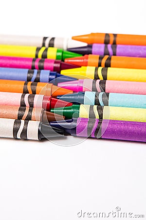Crayons border on white drawing paper. Stock Photo