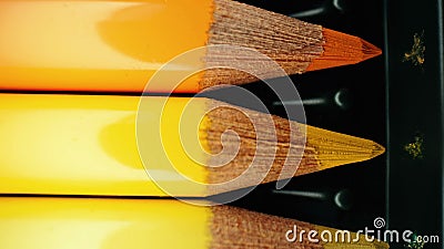 Crayons in yellow gradient row. Extreme macro shot. Pencils graphite set. Stock Photo