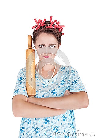 Crazy angry housewife with rolling pin Stock Photo