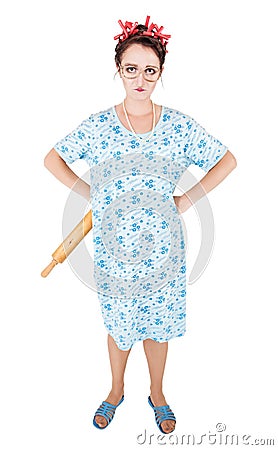 Crazy angry housewife with rolling pin Stock Photo