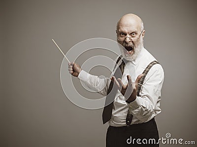 Crazy angry professor yelling and pointing with a stick Stock Photo