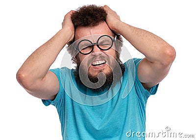 Crazy bearded man has headache Stock Photo