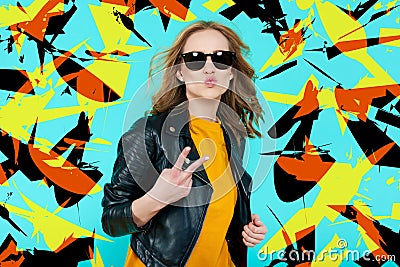 Crazy beautiful rock Girl in leather jacket and black sunglasses. Punk is not dead. Attractive cool young woman blowing a kiss. Stock Photo