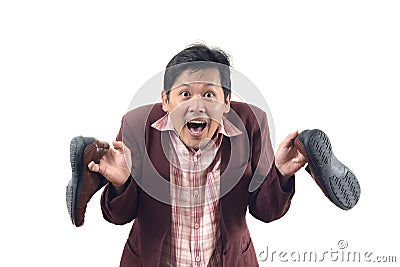 Crazy businessman holding shoes and panic attack, do not get me Stock Photo