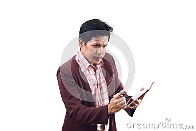 Crazy businessman holding tablet in serious for working hard emo Stock Photo