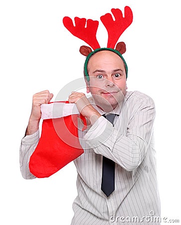 Crazy businessman with rudolph reindeer attire. Stock Photo