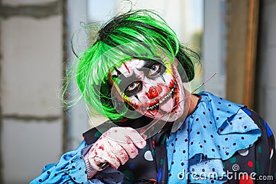 Crazy clown with a knife. Halloween concept Stock Photo