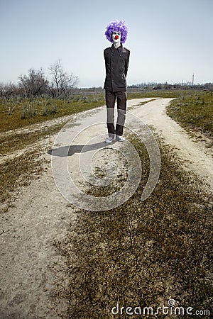 Crazy clown on the road Stock Photo