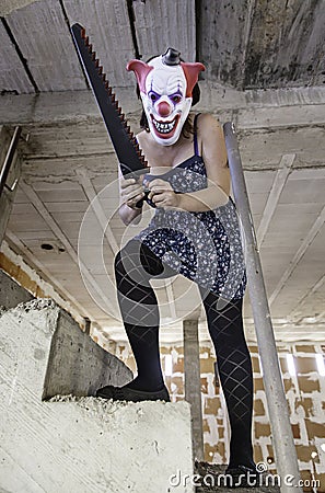 Crazy clown saw Stock Photo