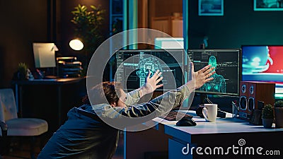 Crazy computer scientist doing worshiping reverence in front of self aware AI Stock Photo