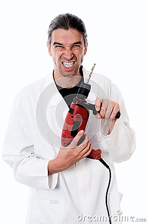 Crazy dentist with drilling machin Stock Photo