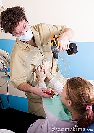 Crazy dentist treats teeth of the unfortunate patient. The patient is terrified. Stock Photo