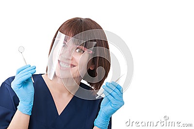 Crazy dentist woman holding tools in hand Stock Photo