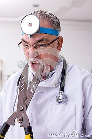 Crazy doctor otologist working in the clinic Stock Photo