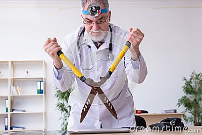 Crazy doctor otologist working in the clinic Stock Photo