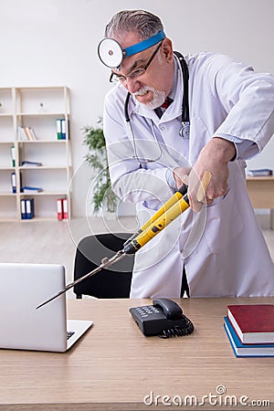 Crazy doctor otologist working in the clinic Stock Photo