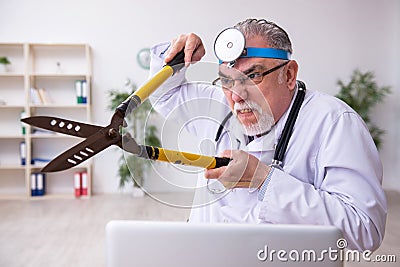 Crazy doctor otologist working in the clinic Stock Photo