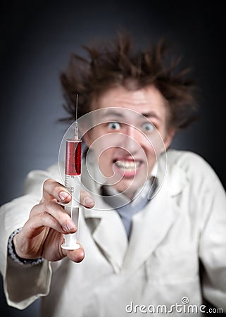 Crazy doctor with syringe Stock Photo