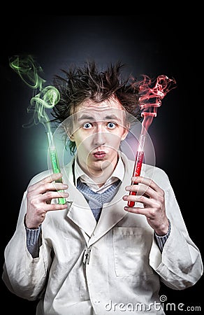 Crazy doctor with test tubes Stock Photo