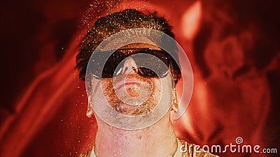 Crazy fun positive face man in gold glitter. Comical photo shake head funny person. Expression emotion guy in sunglasses Stock Photo