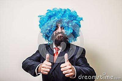 Crazy funny bearded man with blue wig Stock Photo