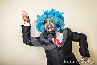 Crazy funny bearded man with blue wig Stock Photo