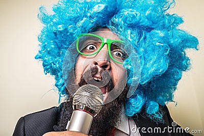 Crazy funny bearded man with blue wig Stock Photo