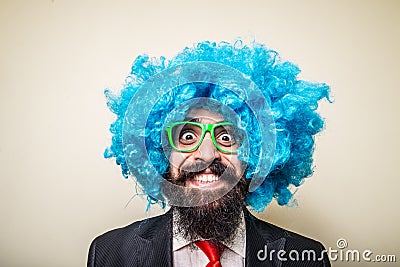 Crazy funny bearded man with blue wig Stock Photo