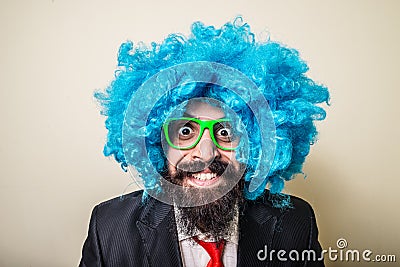 Crazy funny bearded man with blue wig Stock Photo