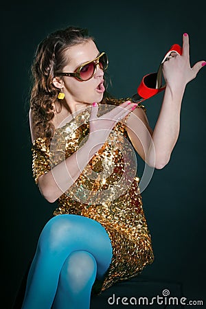 Crazy girl holding shoes Stock Photo