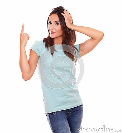 Crazy hispanic female pointing up her finger Stock Photo