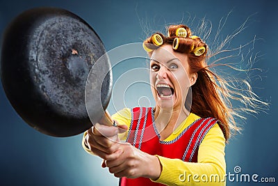 Crazy housewife with pan Stock Photo