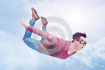 Crazy man in goggles is flying in in the cloudy sky. Jumper concept Stock Photo