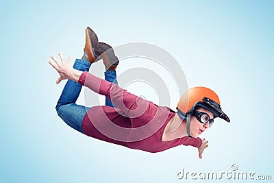 Crazy man in red helmet is flying in the sky. Jumper concept Stock Photo
