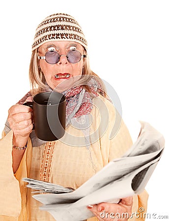 Crazy new age woman in a yellow robe with coffee Stock Photo