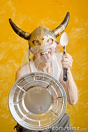 Crazy Old Man in a Viking Helmet Stock Photo