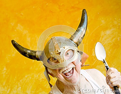 Crazy Old Man in a Viking Helmet Stock Photo