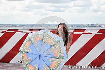 Crazy positive childish comic girl holding umbrella. just having fun Stock Photo