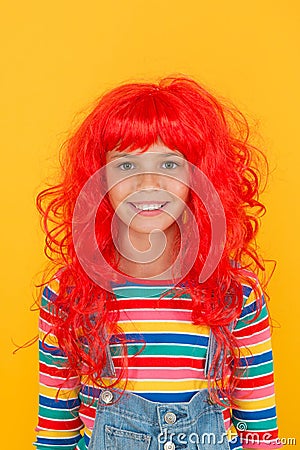 Crazy redhead wig. Messy hairstyle. Kid cheerful smiling happy redhead girl. I am ginger and proud of it. Redhead Stock Photo