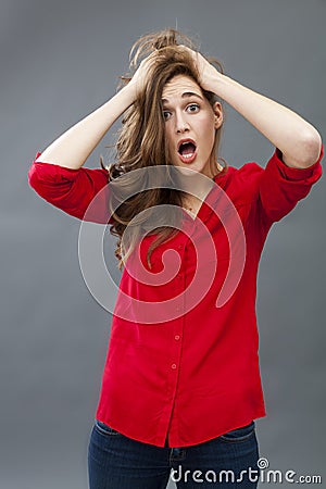 Crazy 20s girl expressing misunderstanding Stock Photo