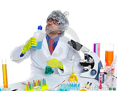 Crazy silly nerd scientist drinking chemical experiment Stock Photo